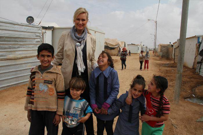 World Vision Ambassador Melissa Doyle with Syrian children in the Za’atari refugee camp in Jordan.