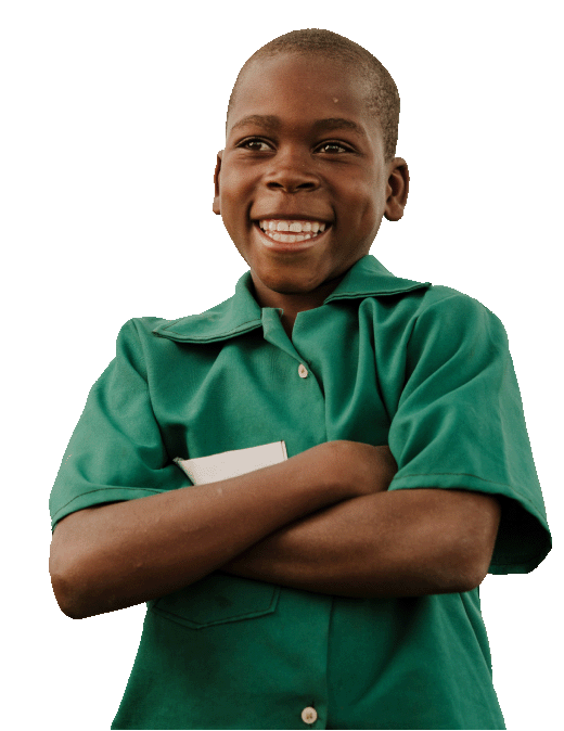 A boy in a green button-up shirt, smiling and standing with his arms crossed.