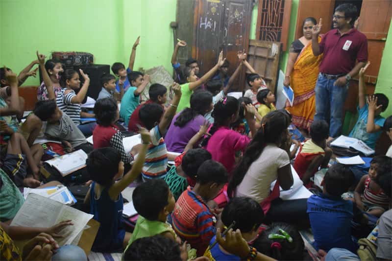 teachers in a classroom teaching children of their rights