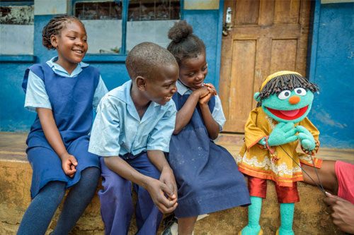 Children in Zambia learn about clean water, sanitation, water hygiene crisis, and global water with Sesame Street Muppets.