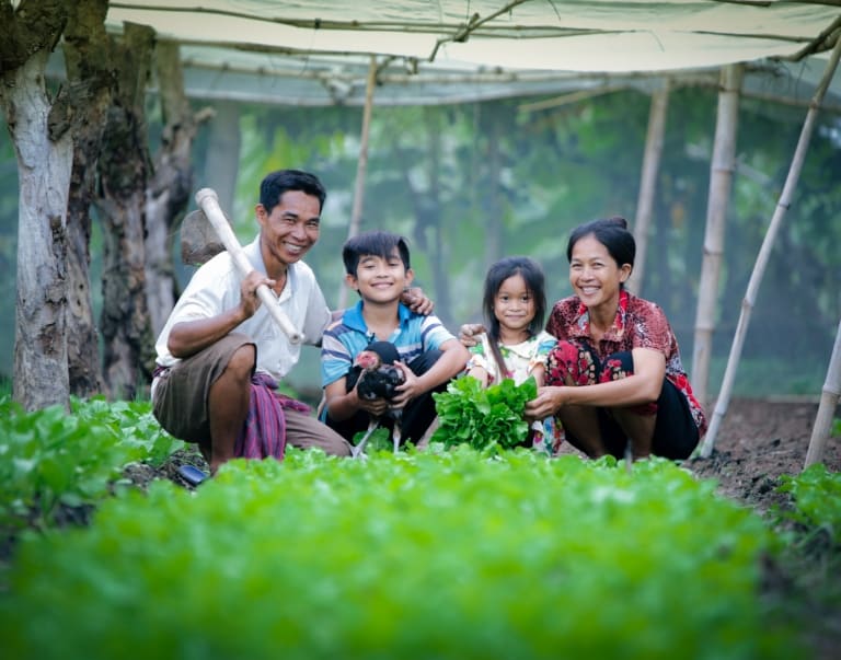 Family sitting with their harvest