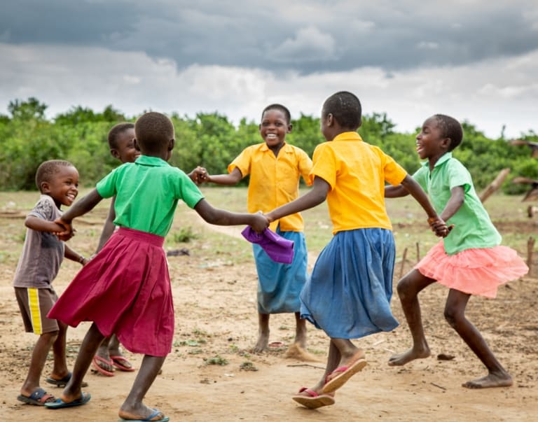 Children holding hands in a circle
