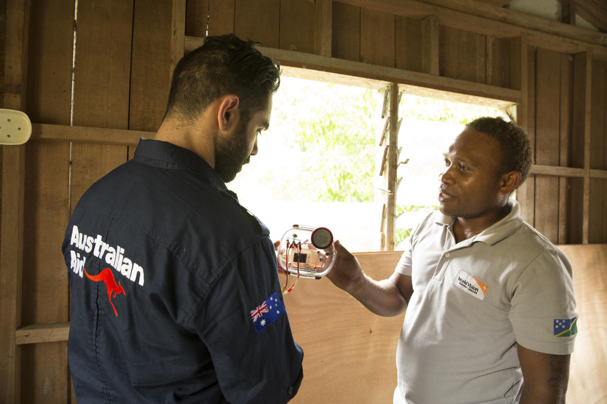DFAT and World Vision Solomon Islands Staff inspecting flood gauges and early warning systems