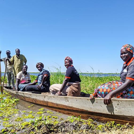The community health workers as they take the boat to cross the Nile River.