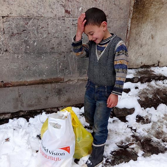 Staff members are distributing packages with essential food and hygiene items, to the extremely poor families in the Kapan Area