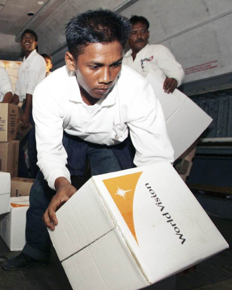 World Vision staff loading emergency supplies onto a plane during the 2004 tsunami response.