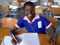 Perserverance, smiling and studying in her classroom at a primary school in Lupane District, Zimbabwe.