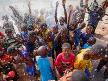 The Djenidie community of Neguela, Mali, celebrating their new borehole, World Vision’s 1,500th borehole drilled in the country.