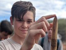 Lachlan, a participant in World Vision's Young Mob Program, pictured here with a spear that the local community in Mutitjulu taught him to carve and throw.