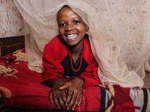 Belyse and her family from Zimbabwe feel safe sleeping under their mosquito nets.