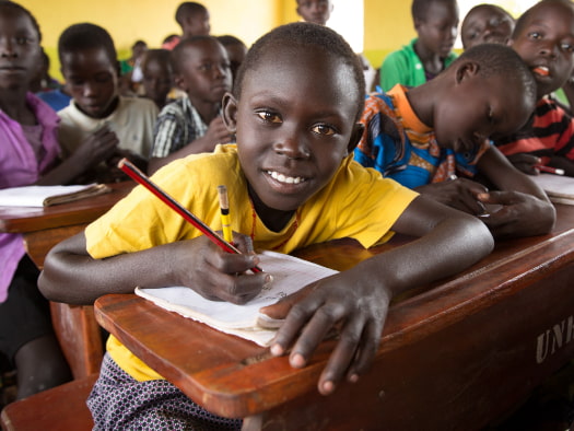 Doruka and her classmates in northwest Uganda solve maths problems in their grade three class.