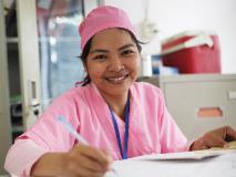 Health staff at the Prey Belong Health Centre in Cambodia take notes on health check follow-ups for children in the local community.