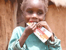 At this health clinic in war-torn South Sudan, proud mother Kiden displays the high-energy biscuits that help her child to thrive.