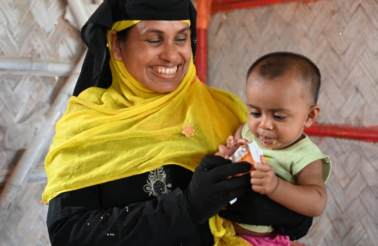 Mother and child with emergency food for malnutrition