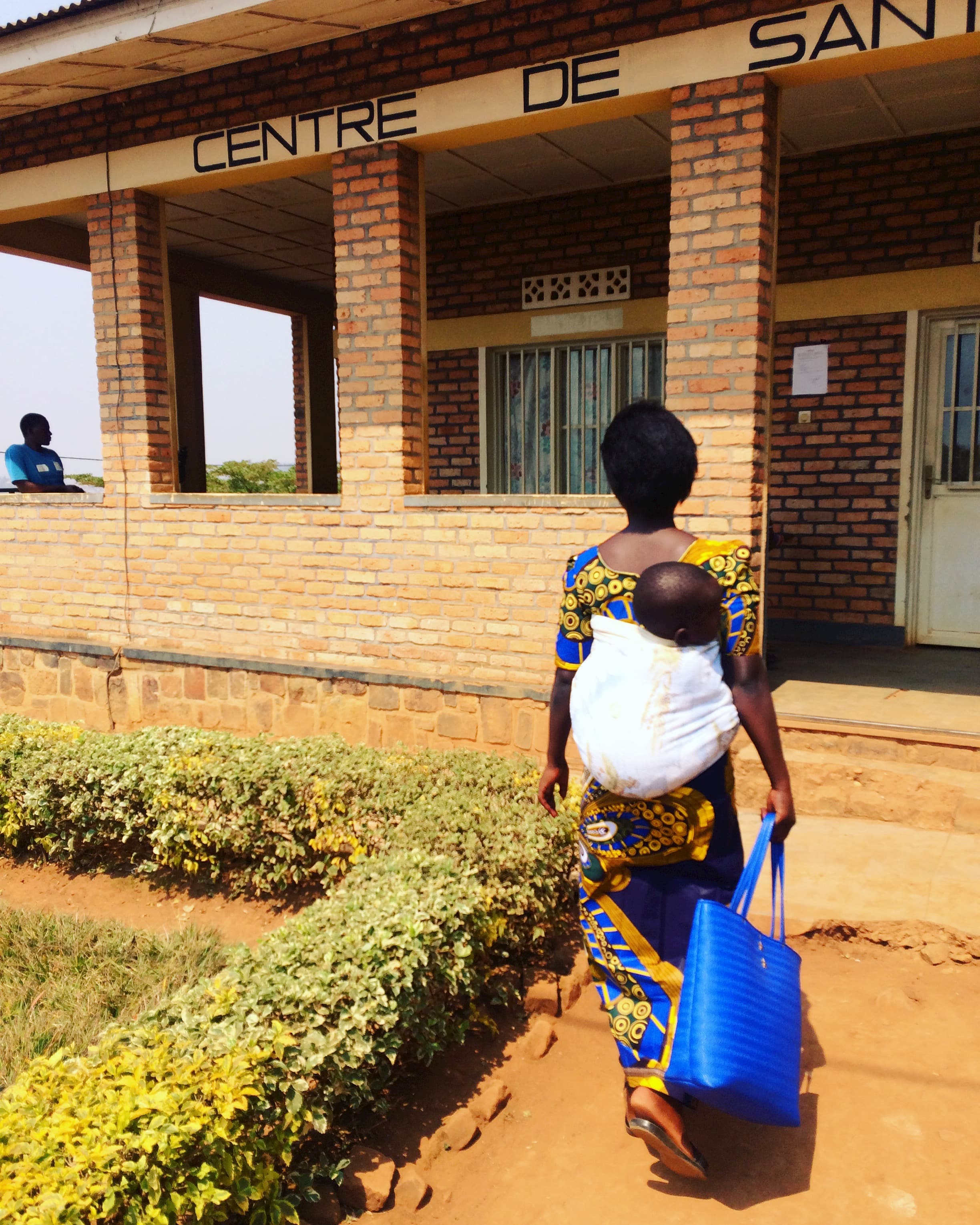 Mother and baby enter Rwanda health centre