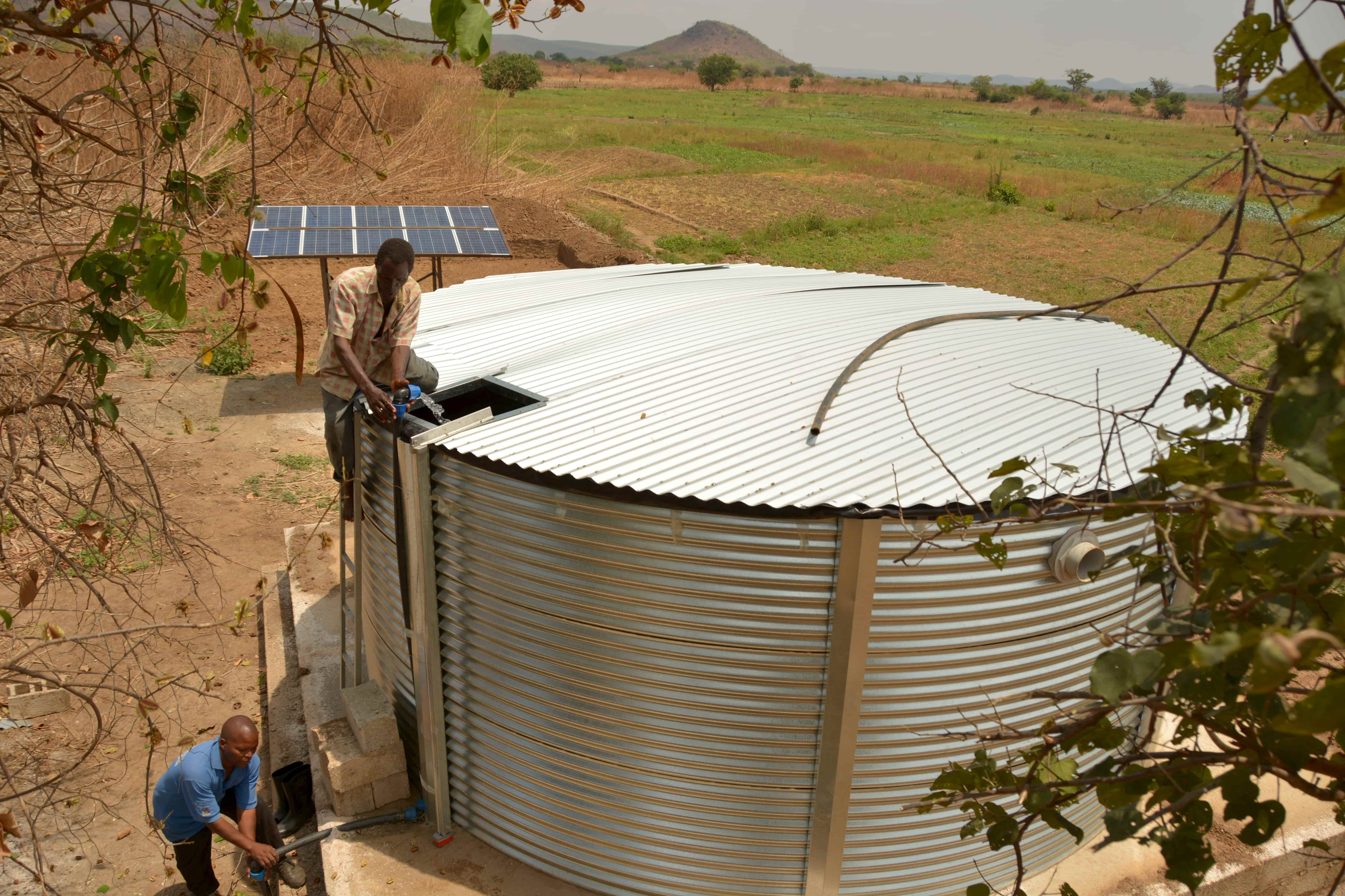 Farmers using Zambian water tank