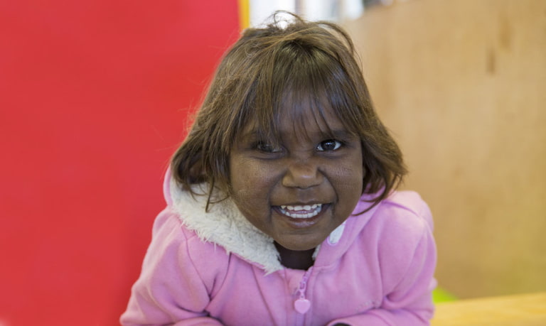 Australia programs with smiling child