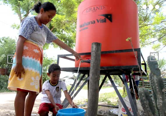 After the Central Sulawesi earthquake in Indonesia, families get clean water from a World Vision water point.